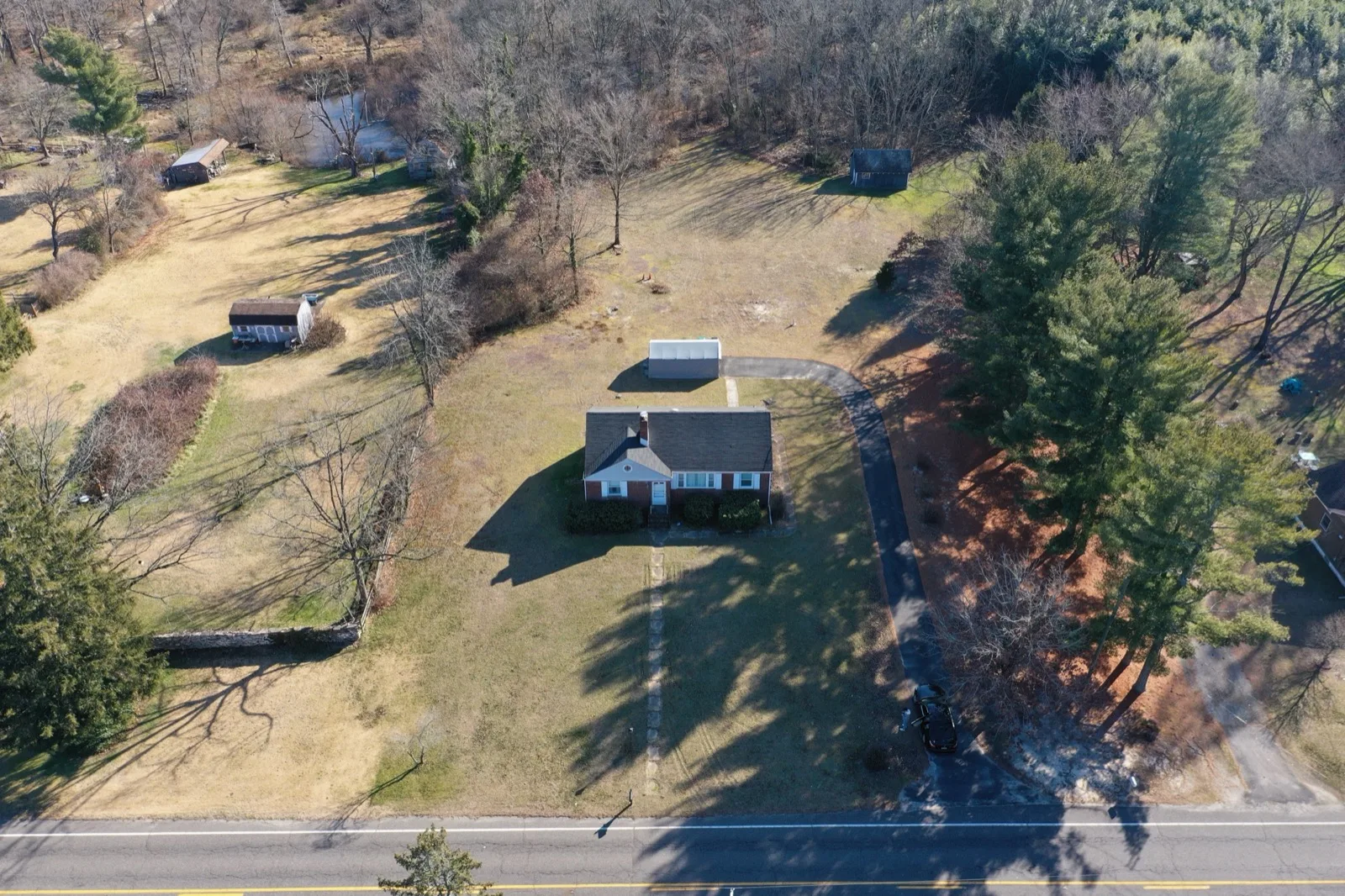 Aerial view of a house on open land beside a road in Hammonton, Atlantic County